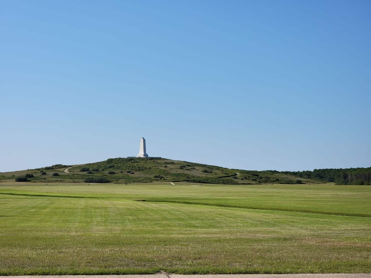 Wright Brothers Memorial on a grassy hill 