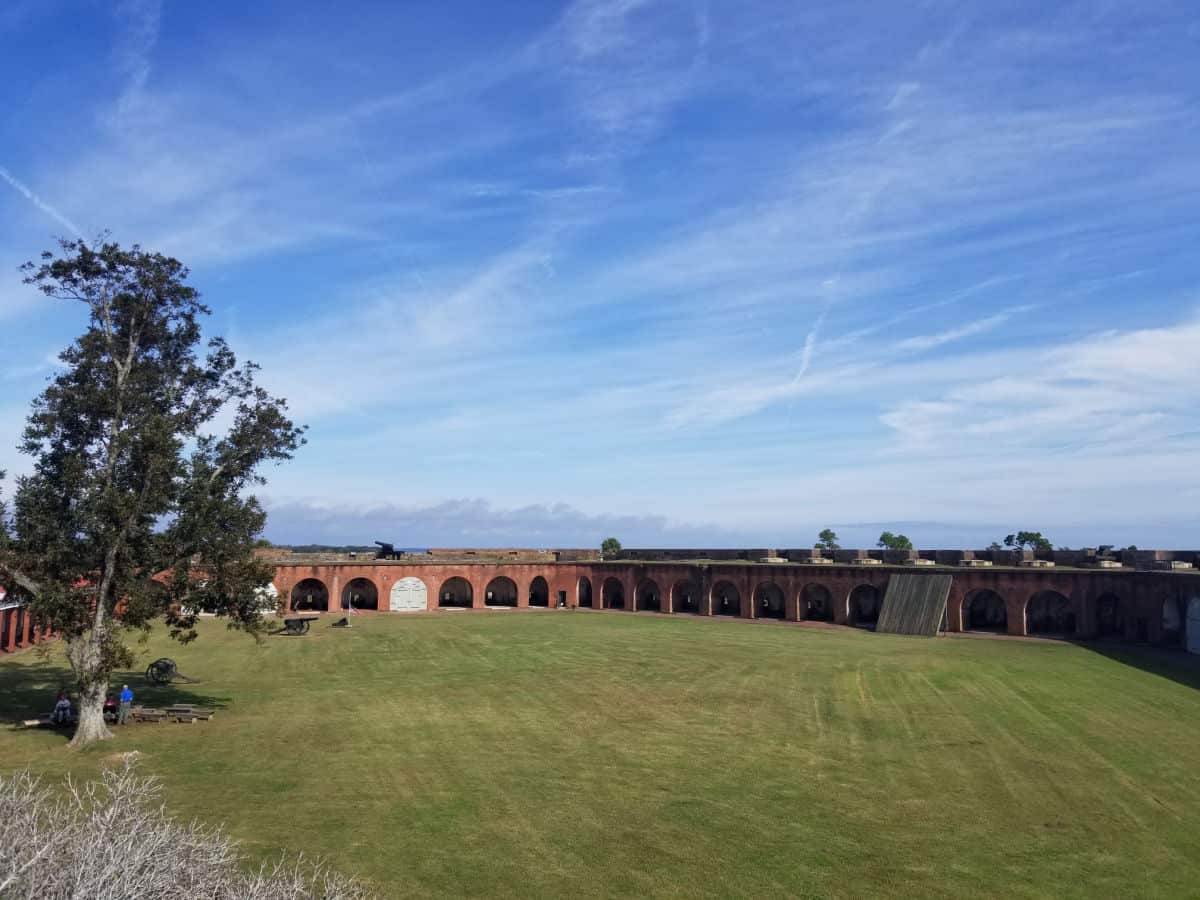 Grass lawn surrounded by Fort Pulaski on a sunny day