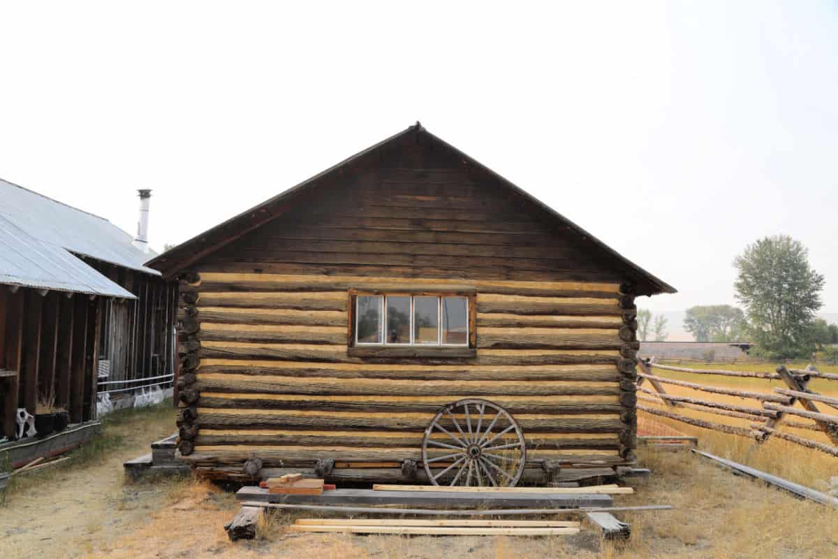 Wooden Ranch Building with a wagon wheel leaning against it