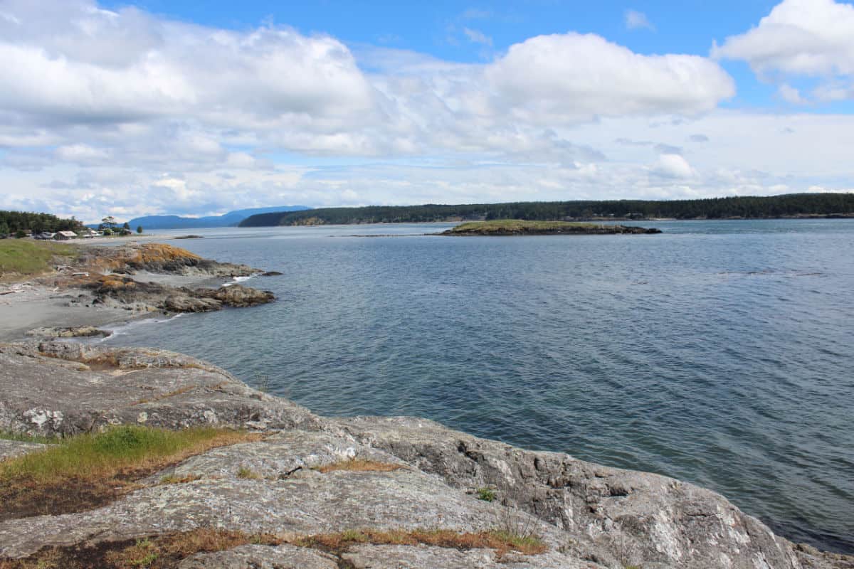 Looking out from a rocky beach to Puget Sound and nearby islands