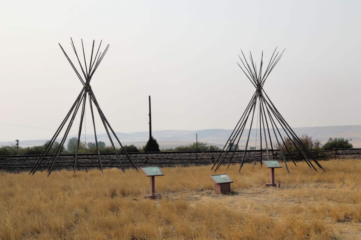 Teepee Poles with Grant-Kohrs Ranch interpretive panels