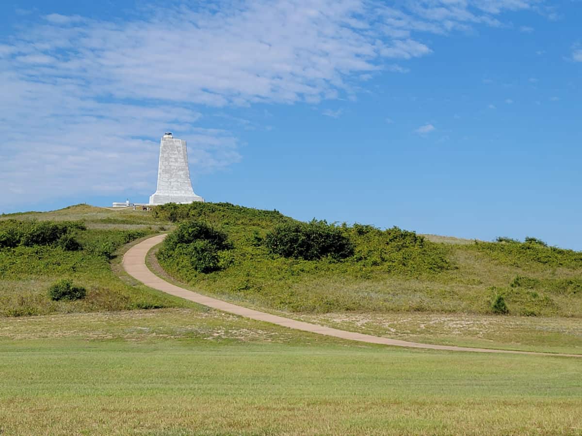 paved trail leading up to the wright brothers memorial