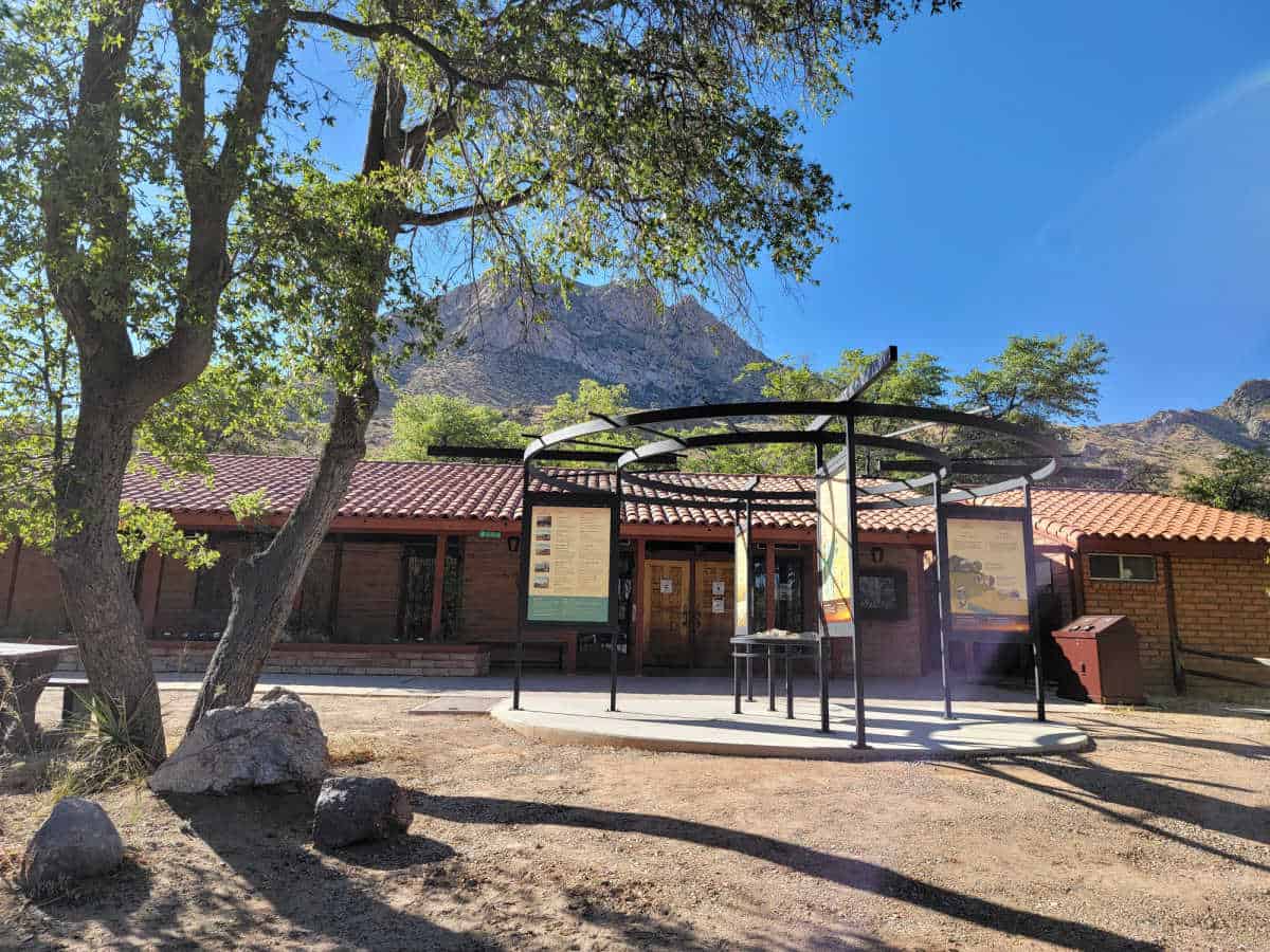 Coronado visitor center exterior with interpretive displays and a large tree