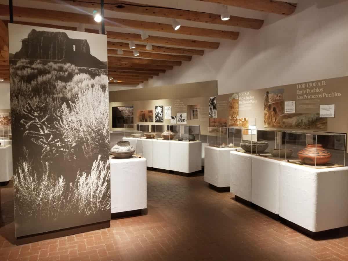 Visitor center display with historic clay pots in Pecos NHP