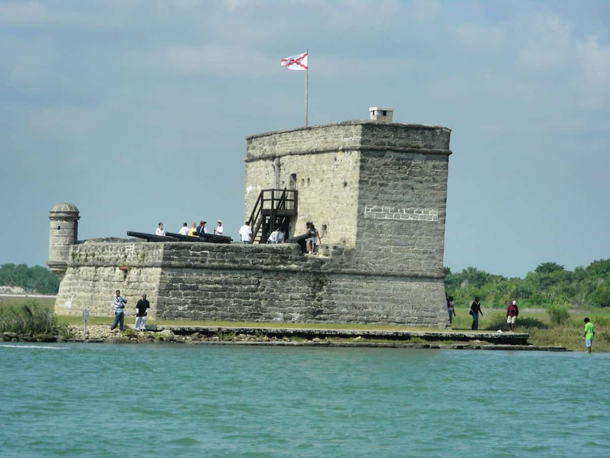 visitors walking on Fort Matanas with water surrounding the fort