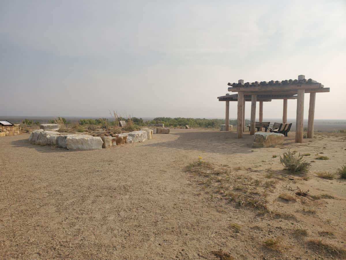 covered seating on a dirt hill