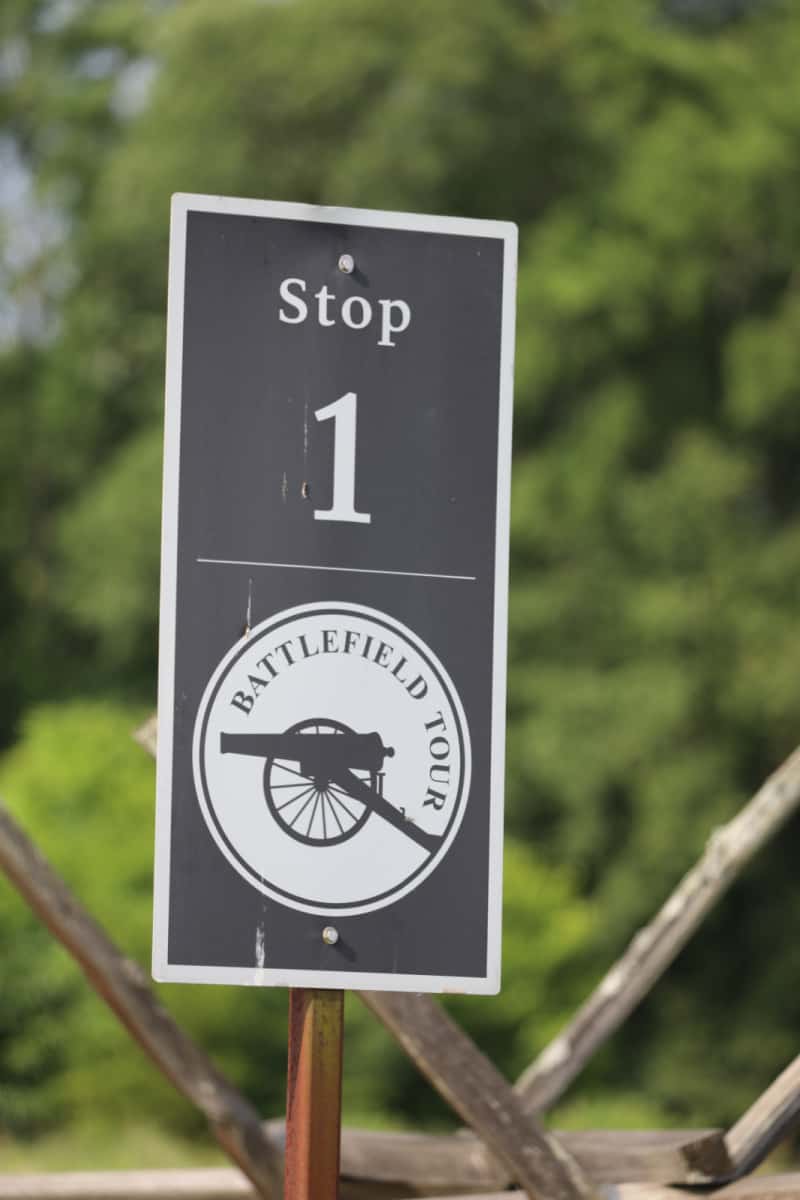 Battlefield tour stop 1 sign with historic cannon on it