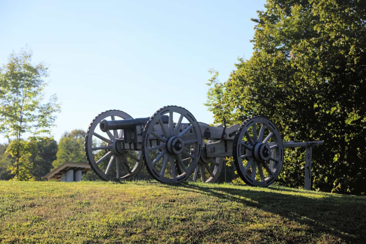Cannons on a hillside with interpretive panels