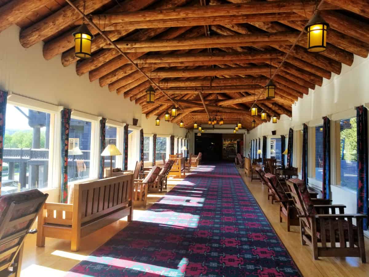 Wooden benches lining a walkway with windows