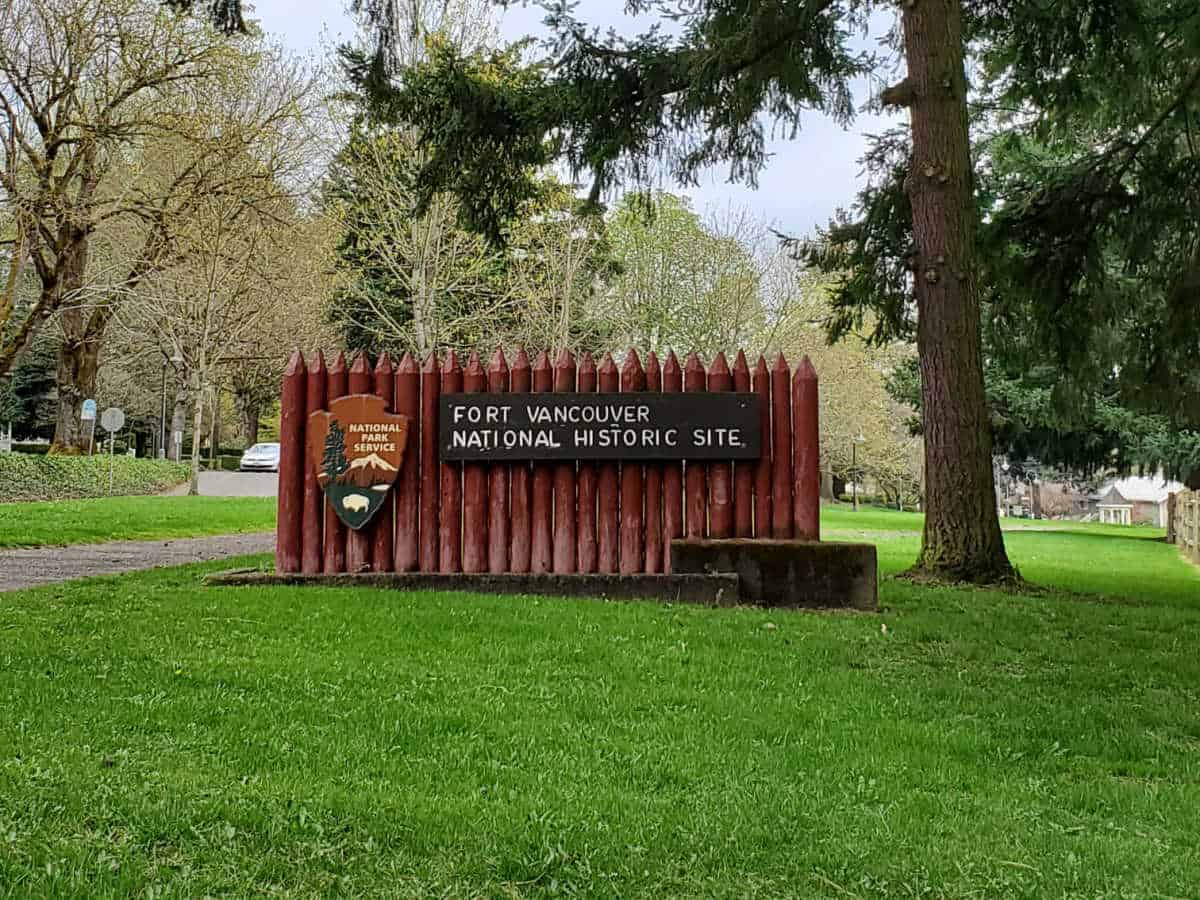 Wooden entrance sign for Fort Vancouver National Historic Site with National Park Service Emblem
