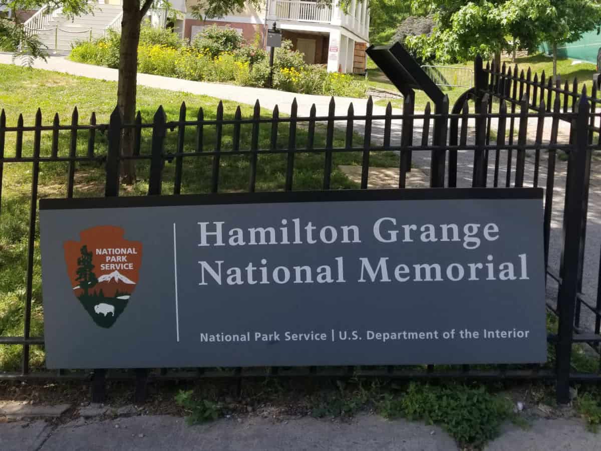 Hamilton Grange National Memorial entrance sign next to a black fence