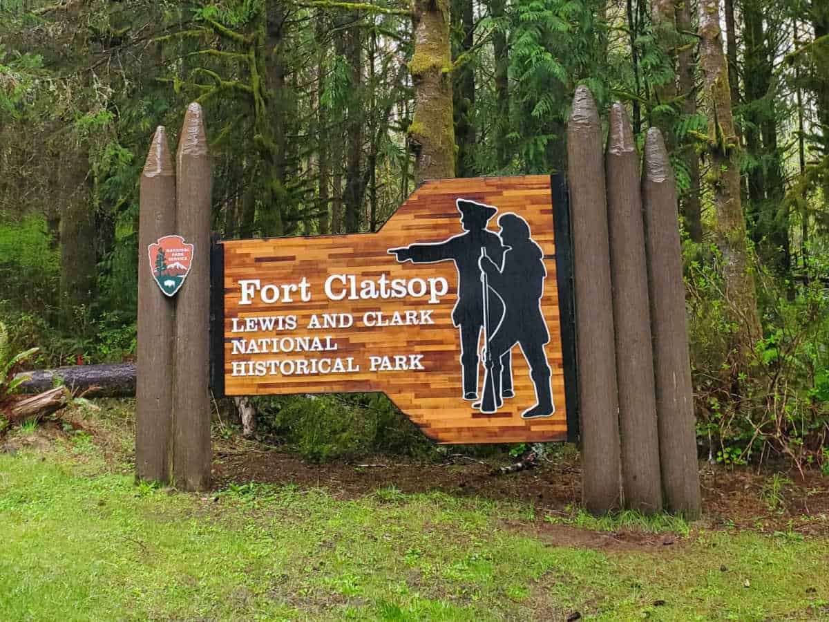 Fort Clatsop Lewis and Clark National Historical Park entrance sign with outlines of Lewis and Clark 