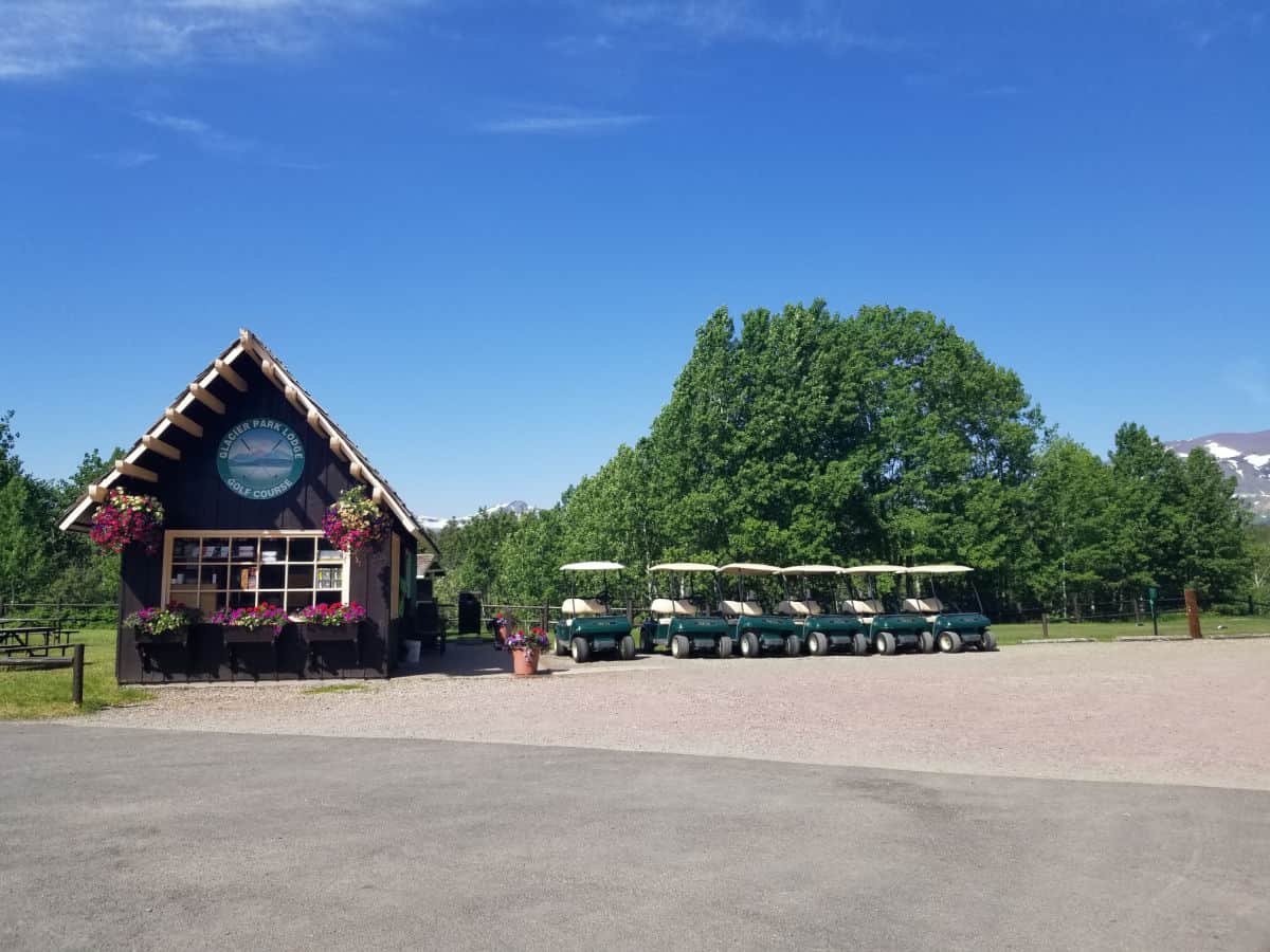 Glacier Park Lodge Golf Course building with golf carts