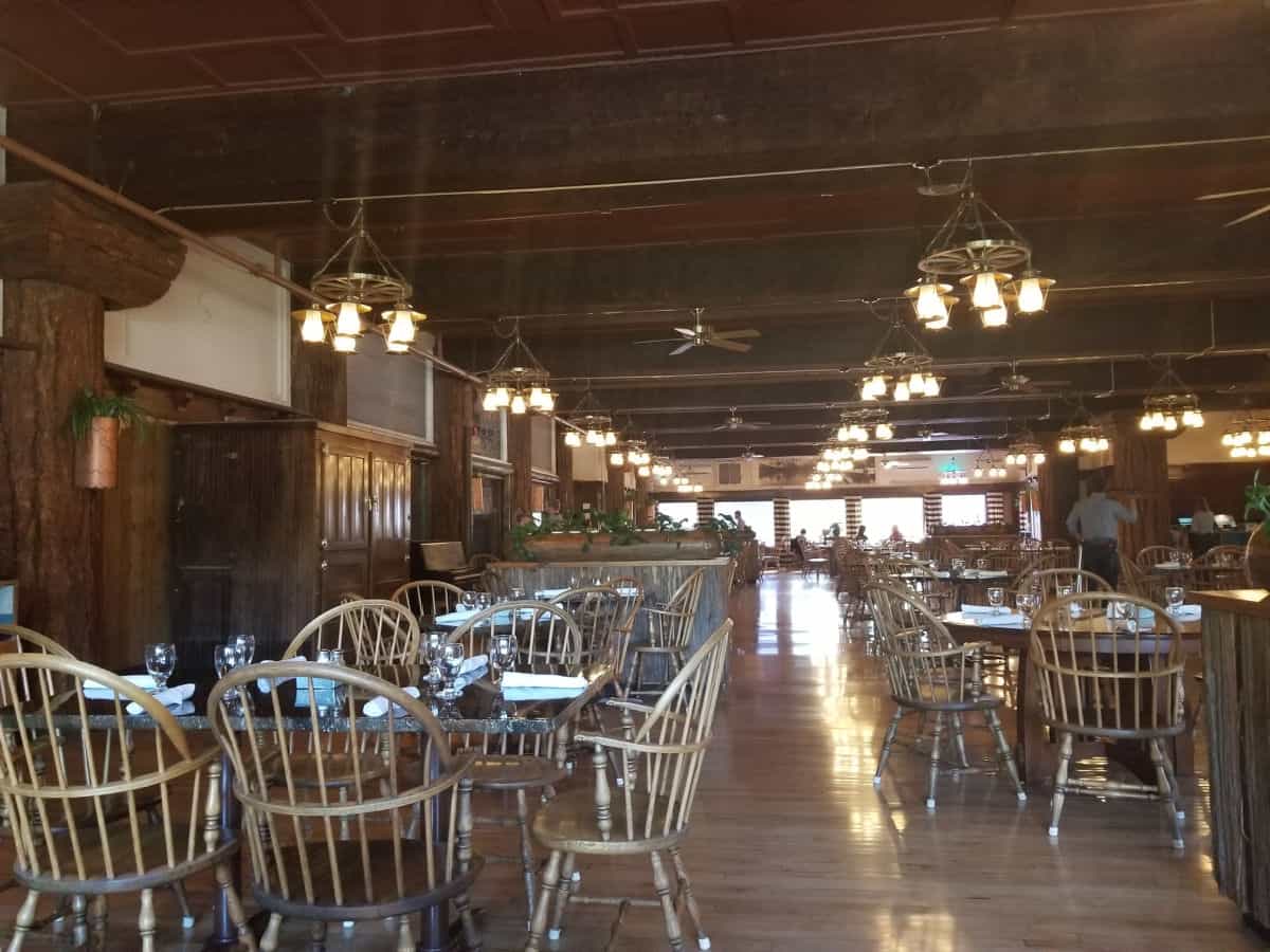 Wooden tables and chairs in the dining room with lamps