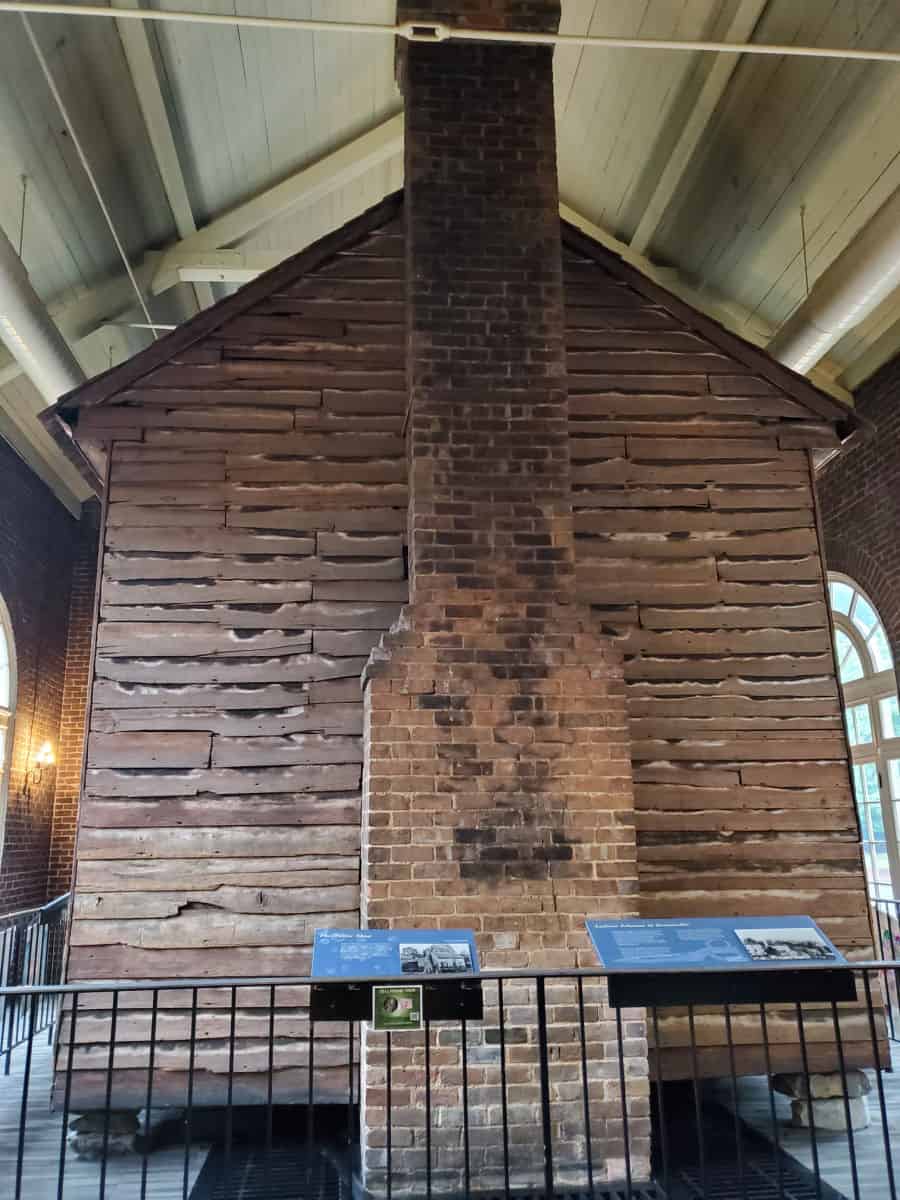 historic wood cabin with interpretive panels