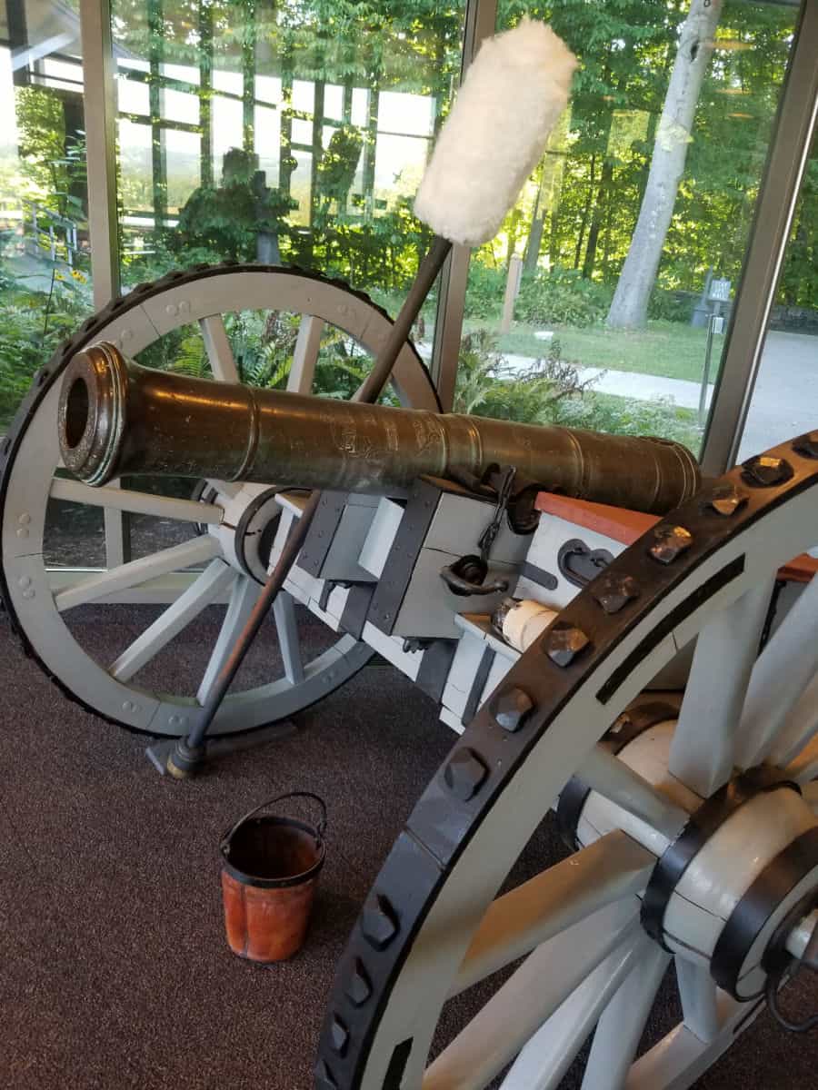 Historic cannon with tools in the visitor center