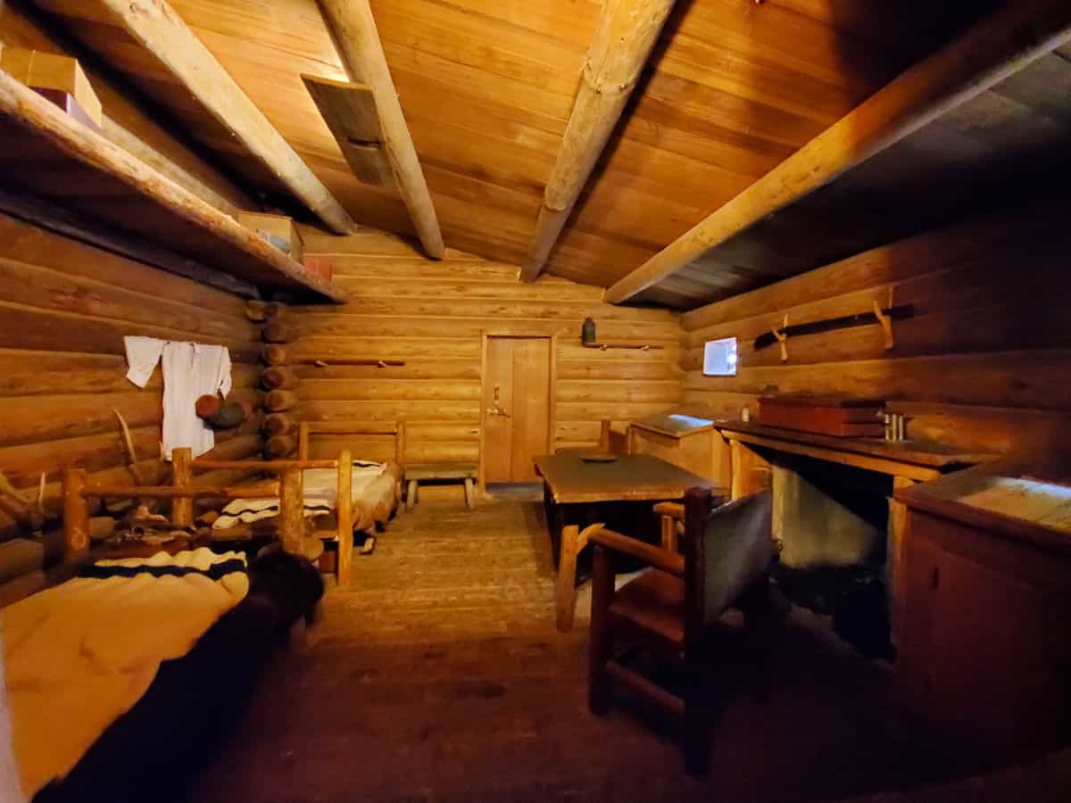 Inside of the wooden historical fort showing bunks 