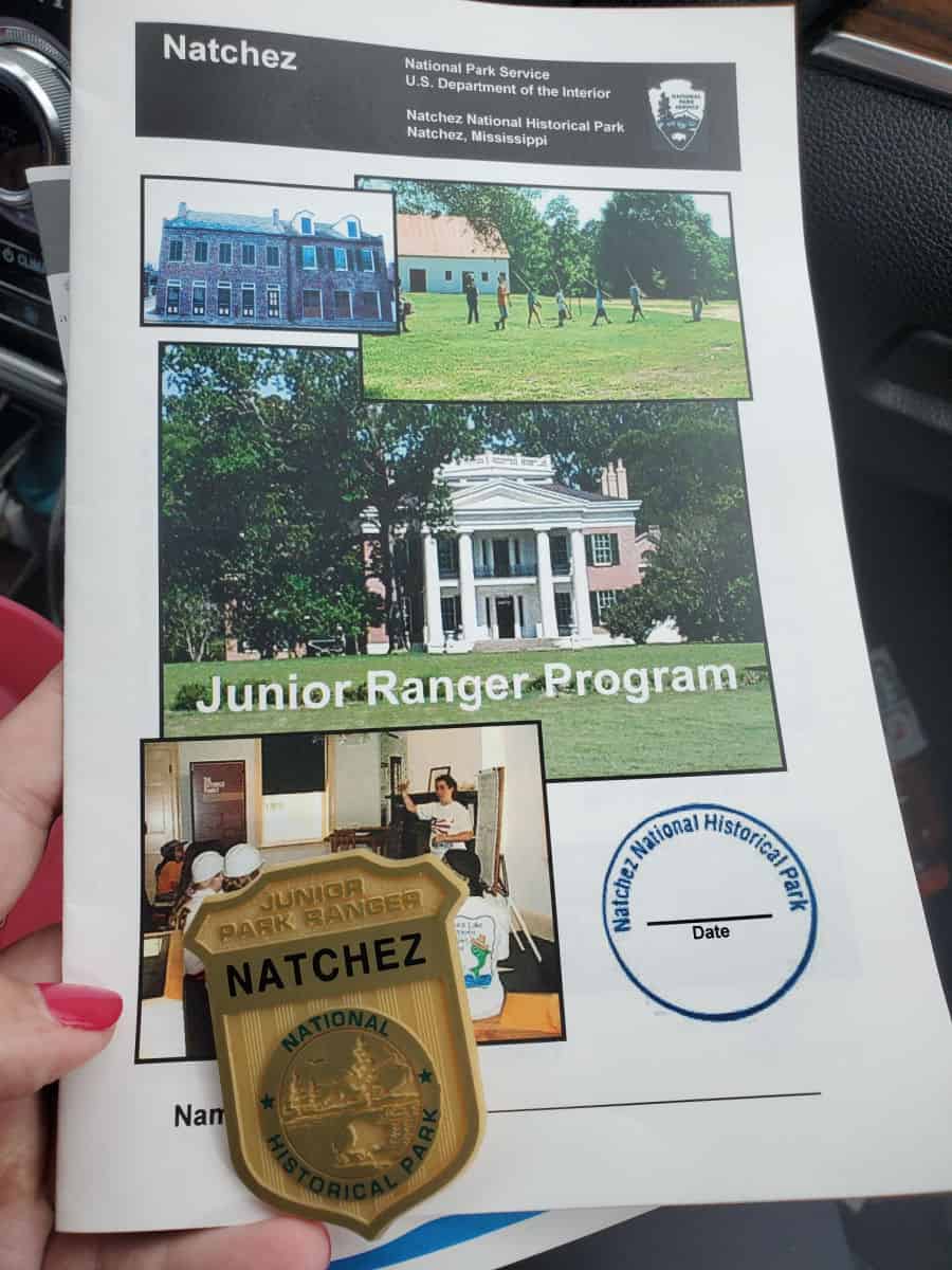 Natchez National Historical Park junior ranger booklet with badge