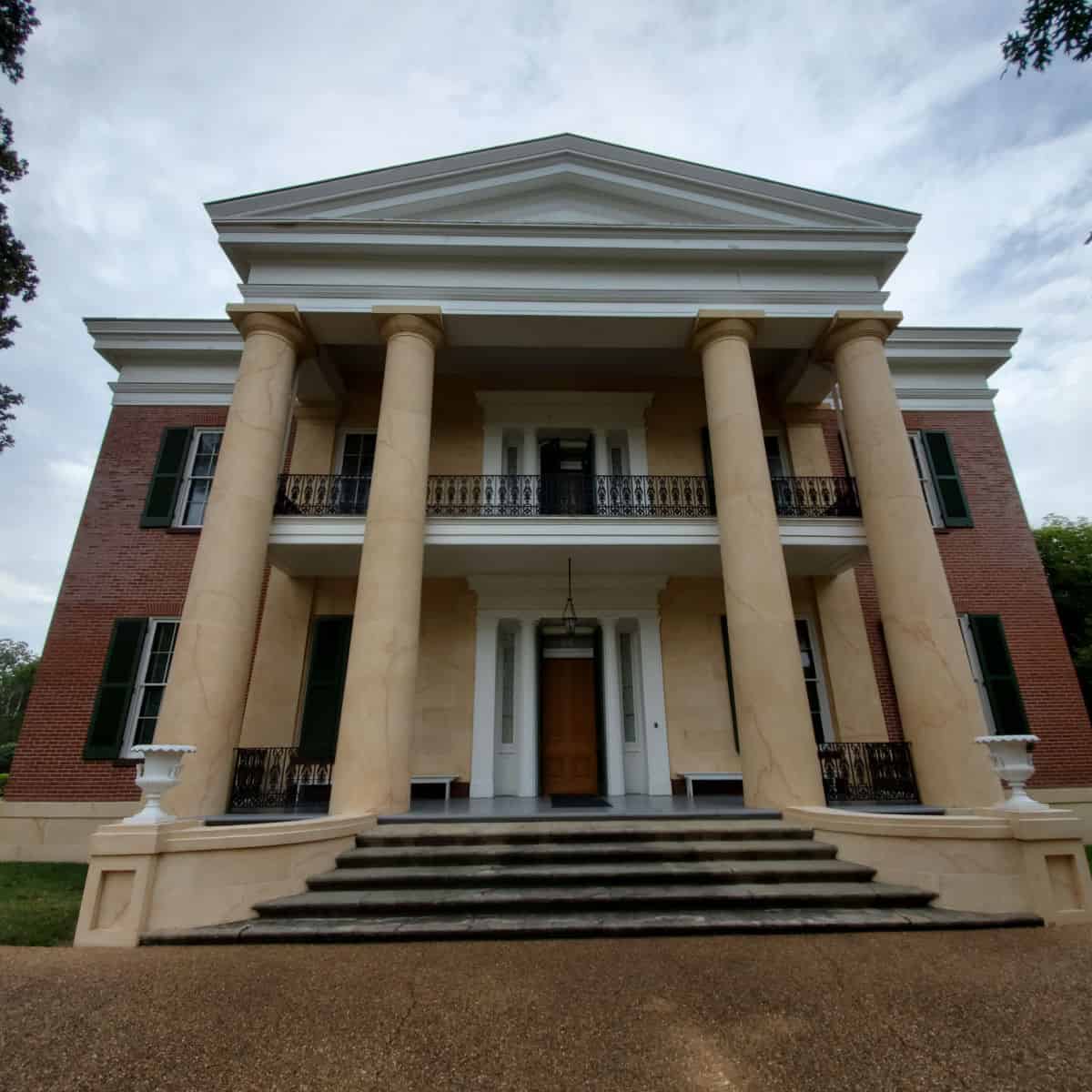 Front entrance to two story antebellum home with columns