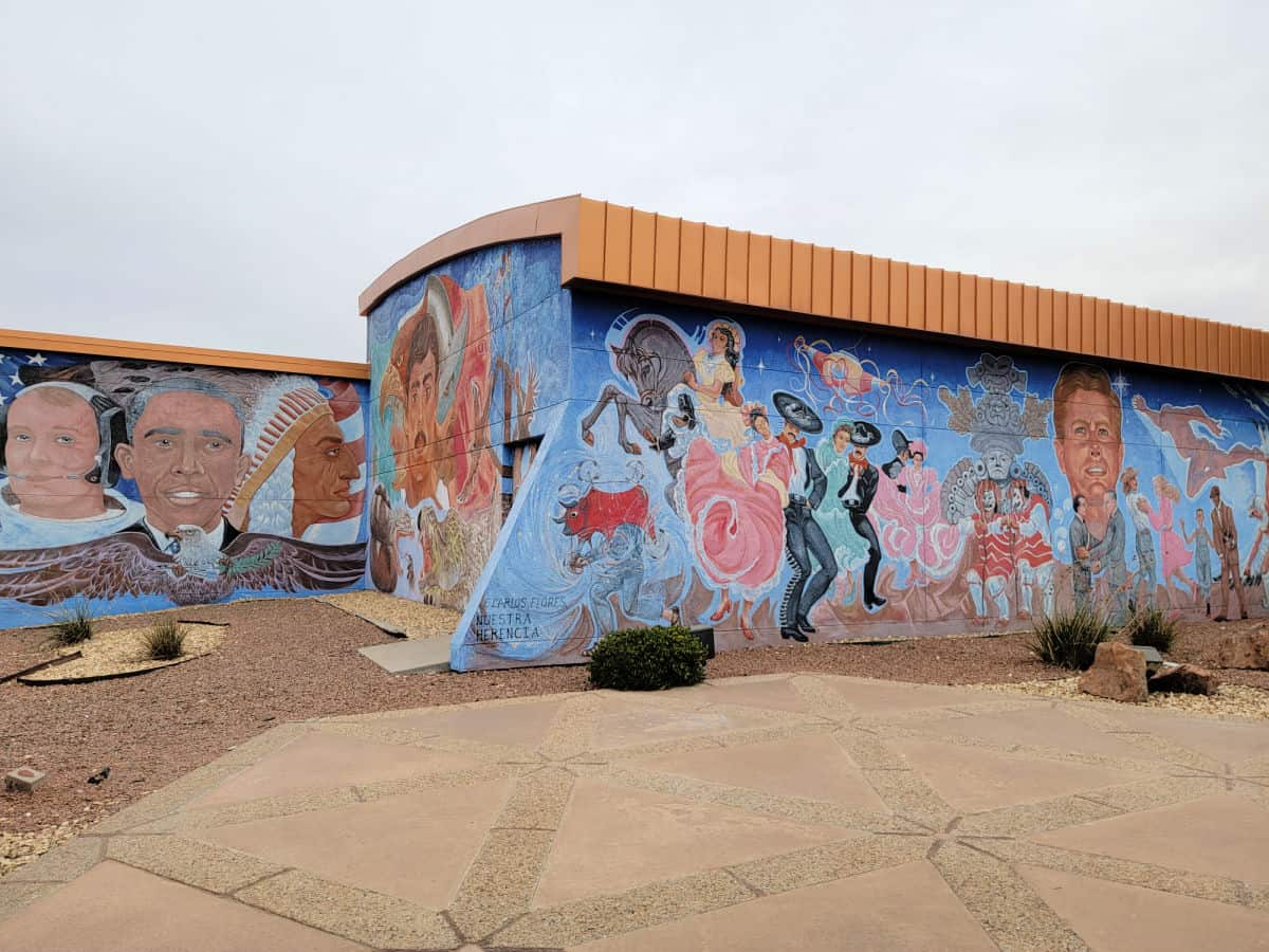 painted murals on the exterior of the Chamizal Visitor Center with Barack Obama, President Kennedy, dancers, and more. 