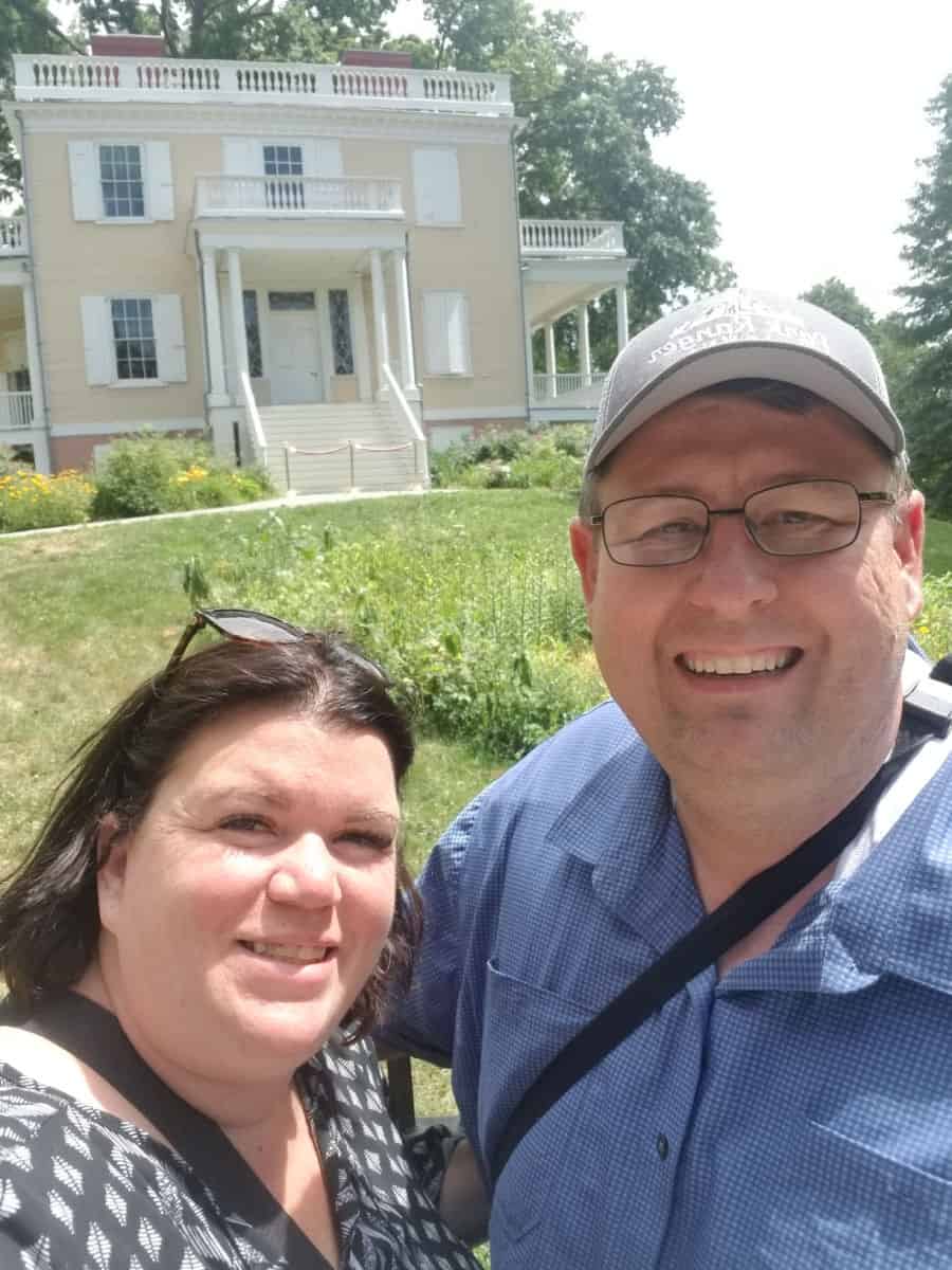 Tammilee and Park Ranger John in front of Hamilton Grange