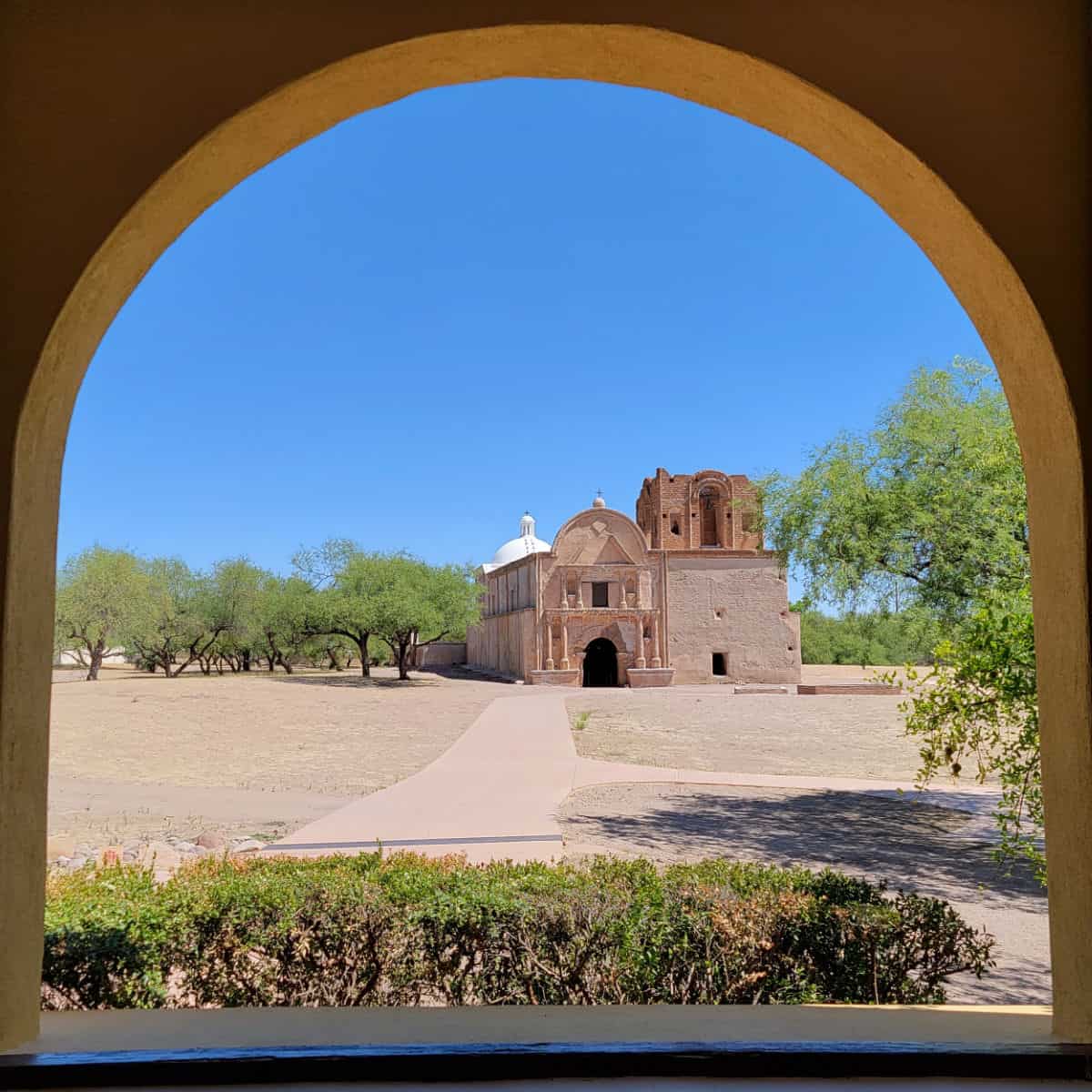 Tumacacori Mission through an arched window