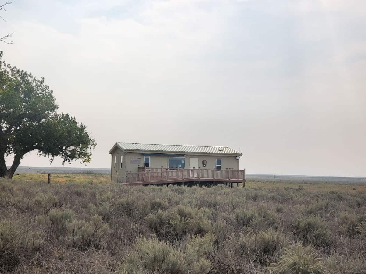 Trailer with NPS symbol near a tree