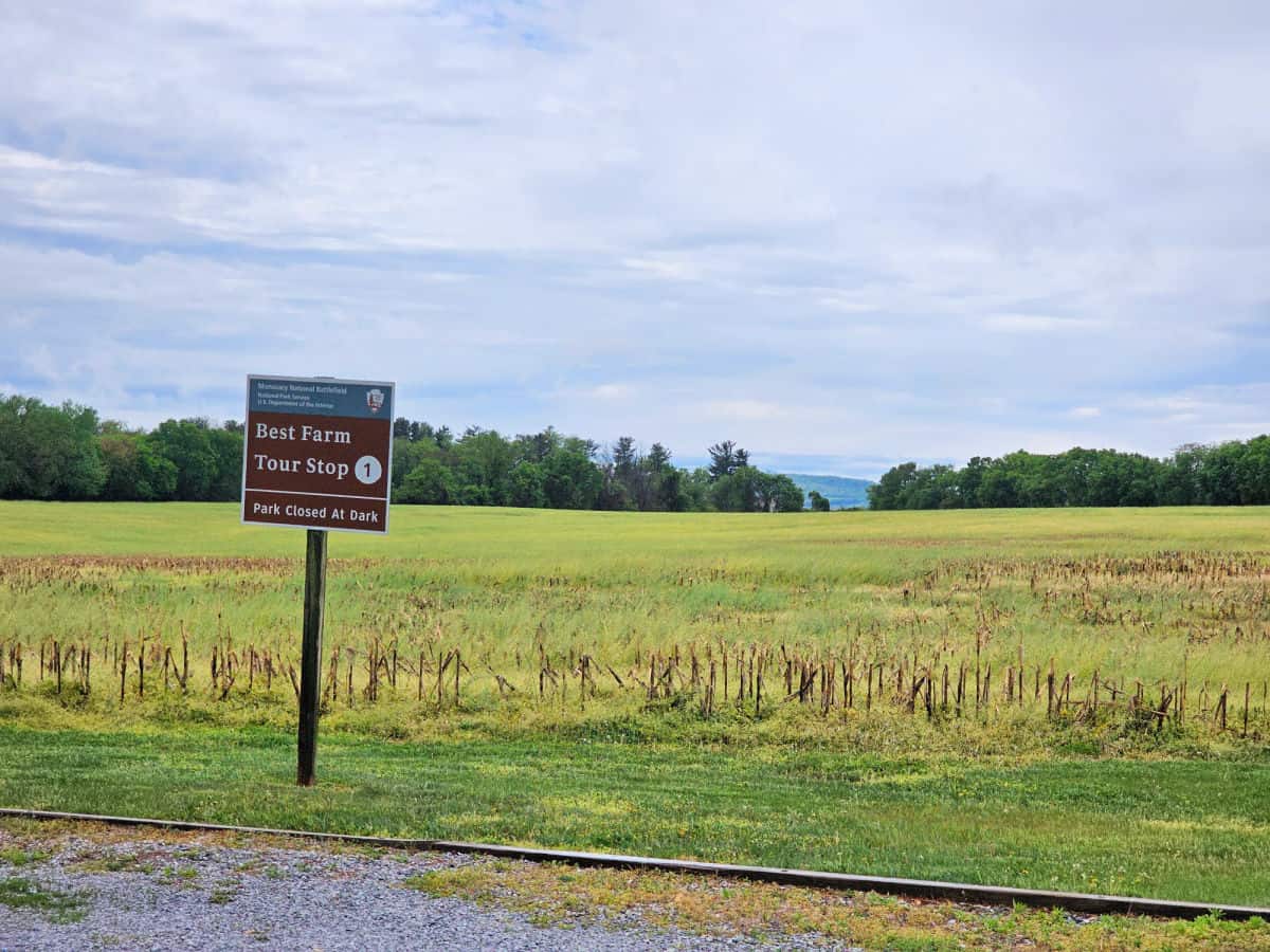 Monocacy Battlefield auto tour sign by a grassy field