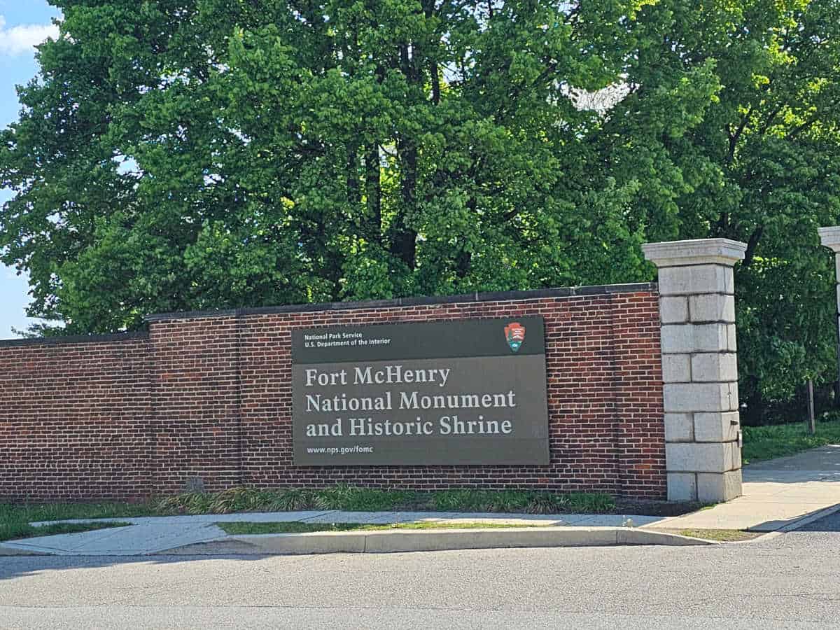 Fort McHenry National Monument entrance sign on a brick wall