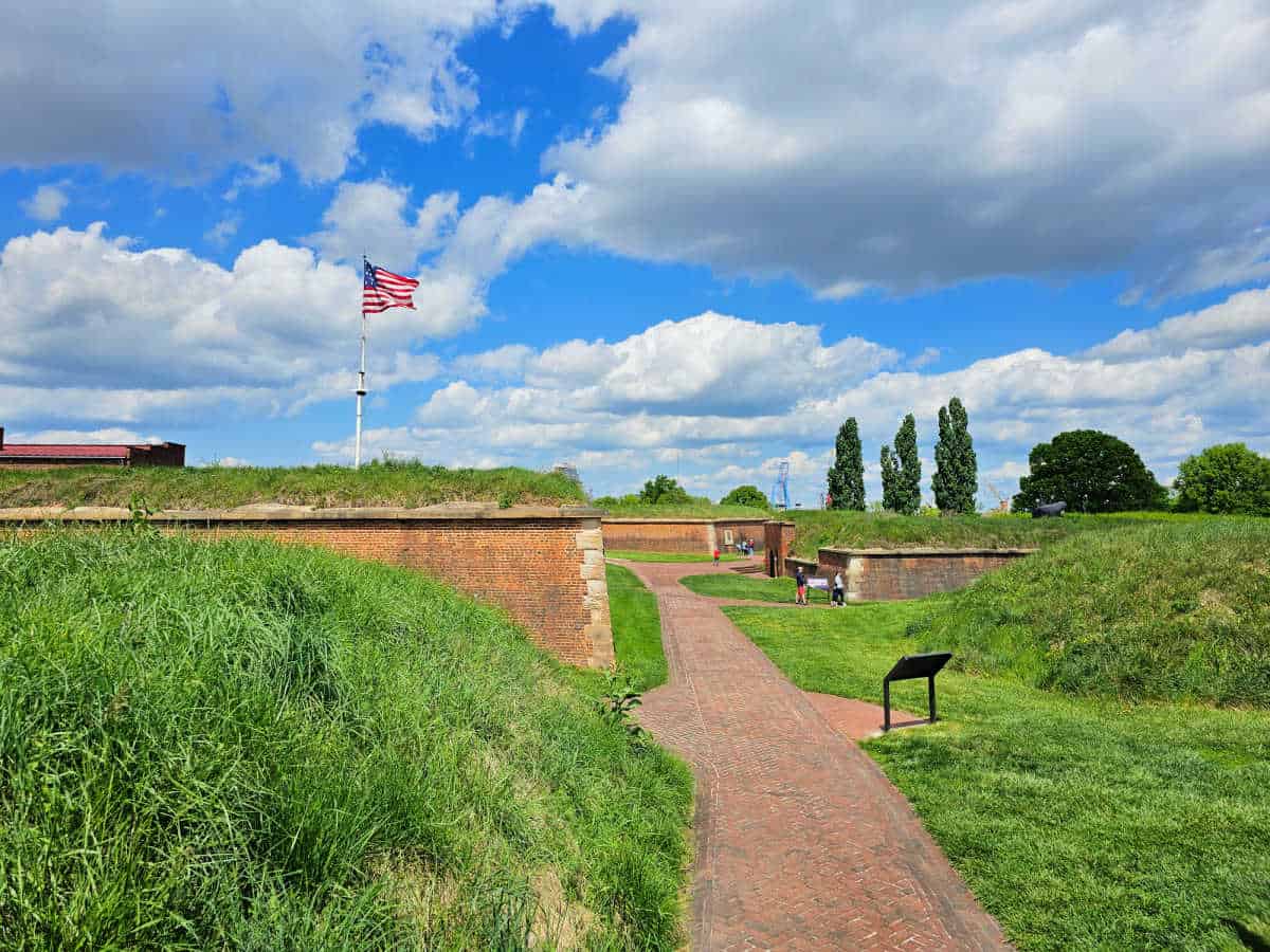 Brick path around historic Fort McHenry with the US Flag flying