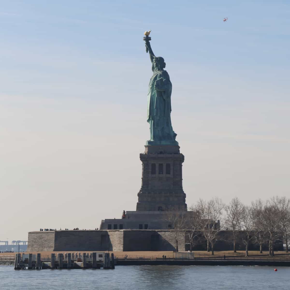 The Statue of Liberty stands tall overlooking New York