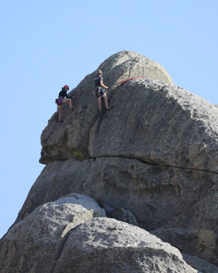 Explore Idaho's Epic National Park Sites like rock climbing at City of Rocks National Reserve in the photo!