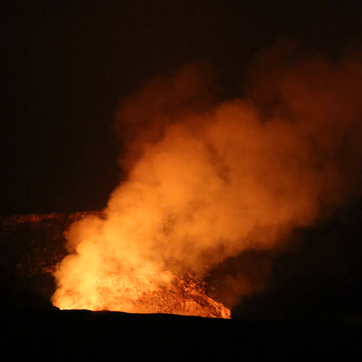 lava flowing at Hawaii Volcanoes National Park on the Big Island of Hawaii