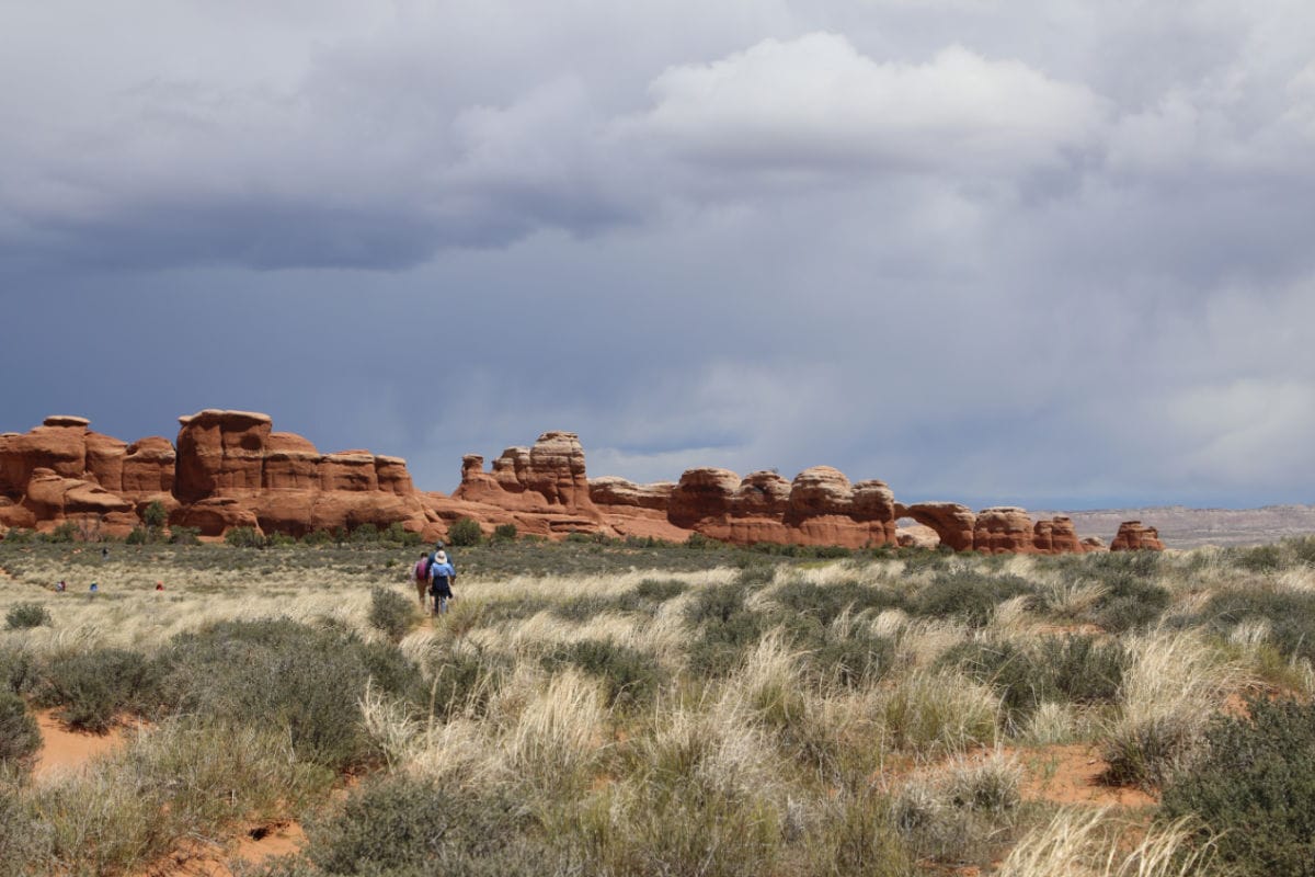 Hiking towards Broken Arch with Broken Arch in the Background