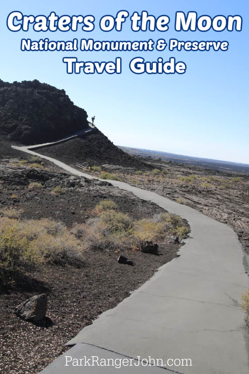 Photo overlooking trail at Craters of the Moon National Monument and Preserve with text reading "Craters of the Moon National Monument and Preserve Travel Guide by ParkRangerJohn.com""