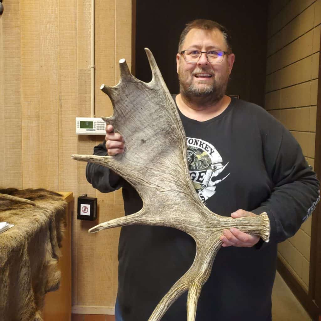 John with Moose Antlers at the Grant Visitor Center