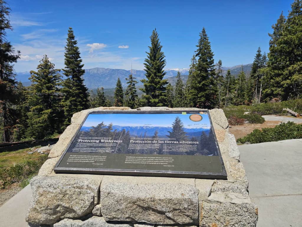 Kings Canyon overlook with interpretive panel looking out to the trees and mountains