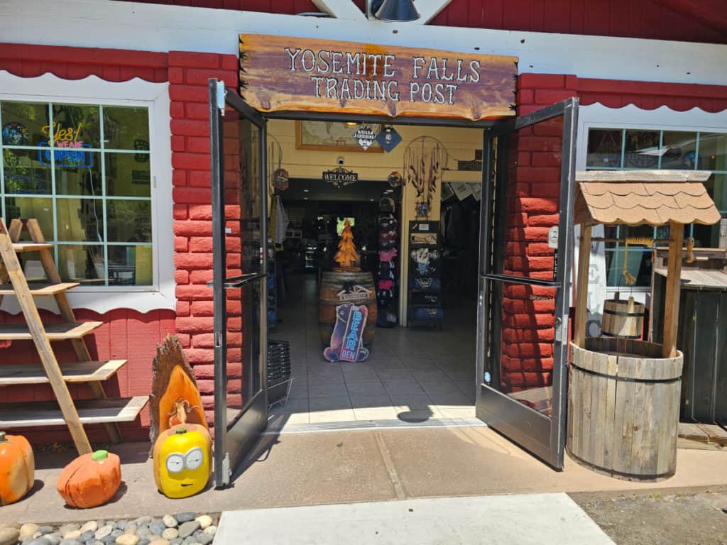 Yosemite Falls trading post sign over the entrance to a store