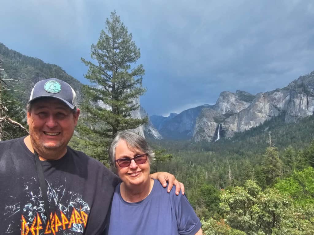 john and his mom at tunnel view with half dome in the background