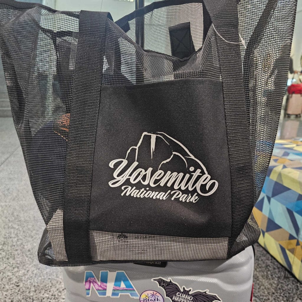 Yosemite national park black bag on top of a suitcase