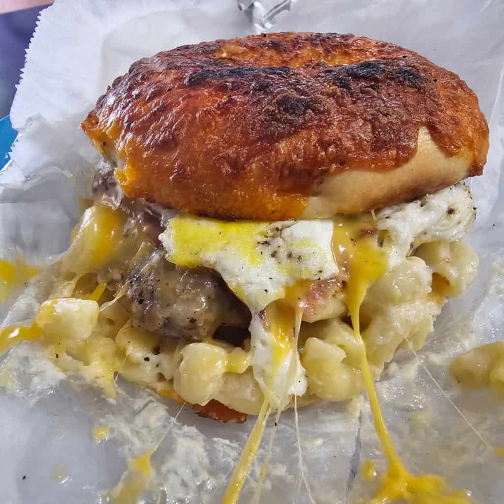 bagel with mac and cheese and sausage from OMFG Oakhurst