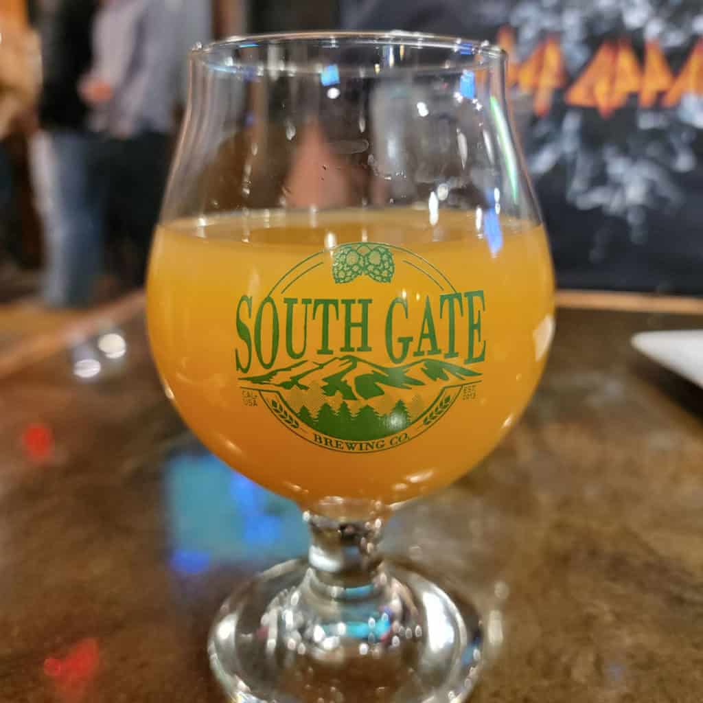 South Gate Brewing Glass with beer in it.